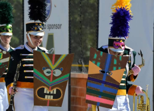 During the percussion section’s solo at finals, some band members provided visual effects with masks while the color guard provided a flag routine to accompany the music.